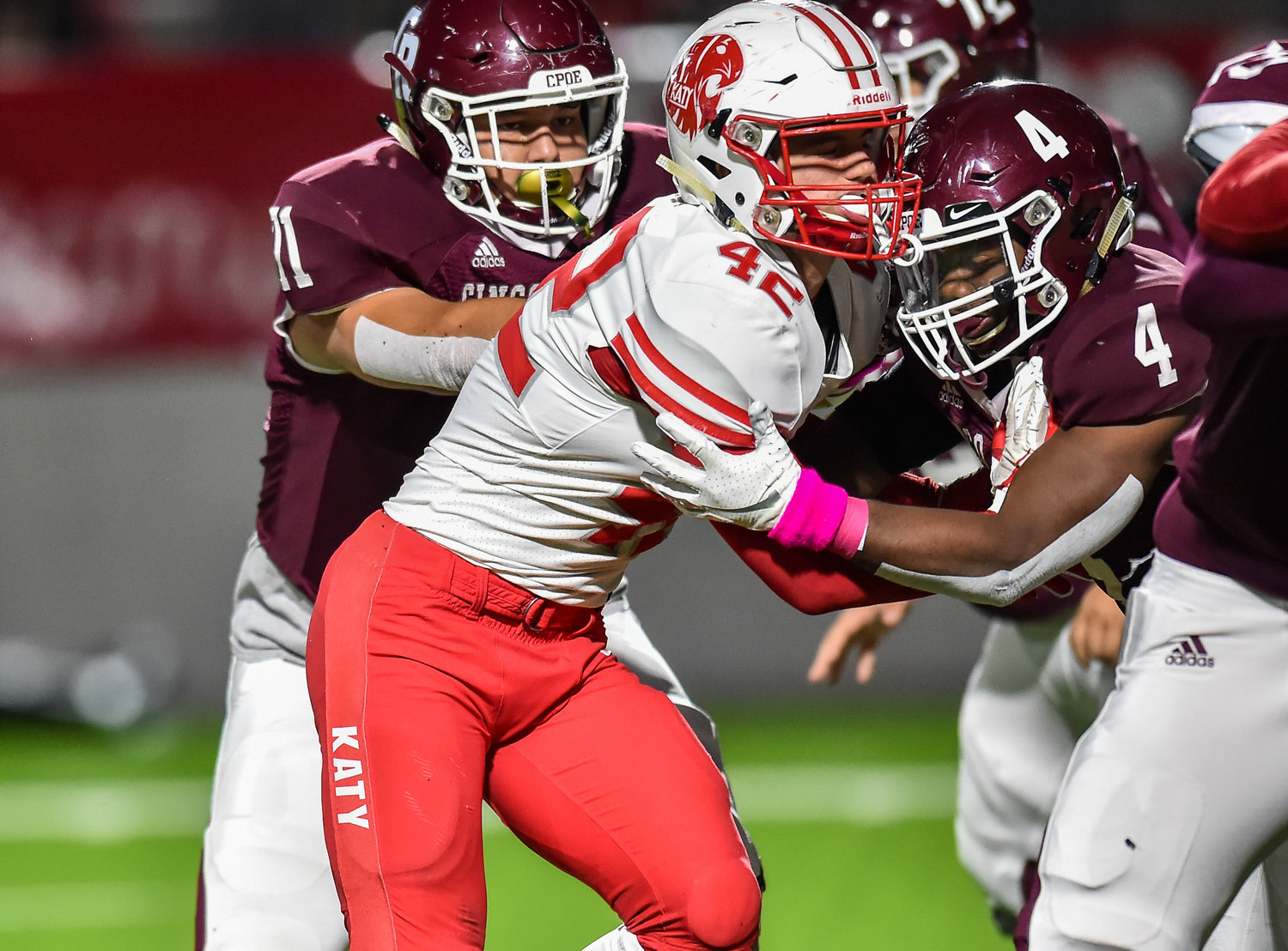 Katy, Tx. Oct. 25, 2019: Katy's Ty Kana (42) tries making his way around Cinco Ranch's GJ Kelly (4) during a conference game between Katy Tigers and Cinco Ranch Cougars at Legacy Stadium. (Photo by Mark Goodman / Katy Times)